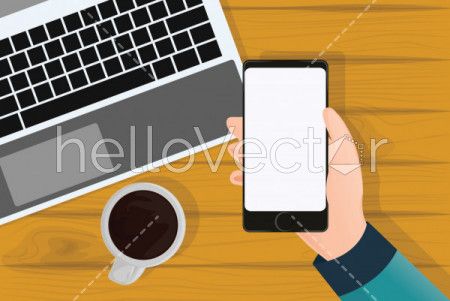 Hand holding mobile phone, Phone blank screen on table top view